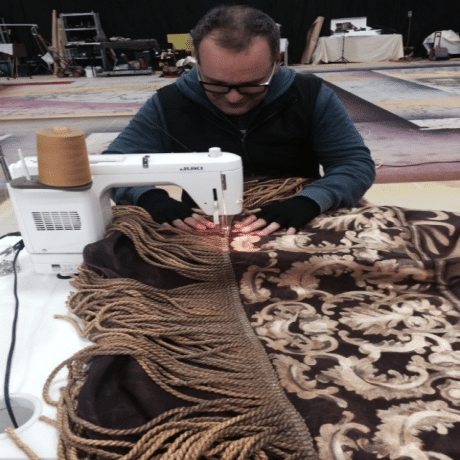 Sewing bullion fringe to drape
